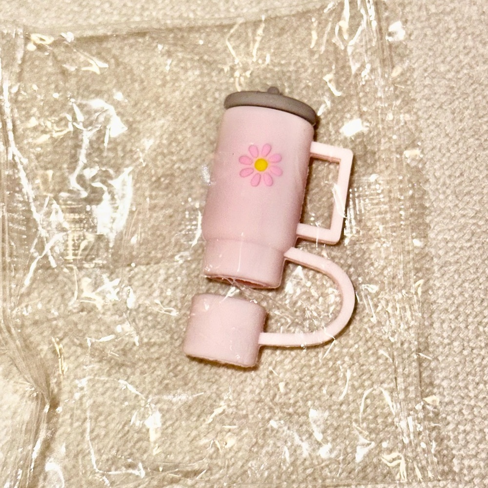Stanley cup silicone straw topper in pink .